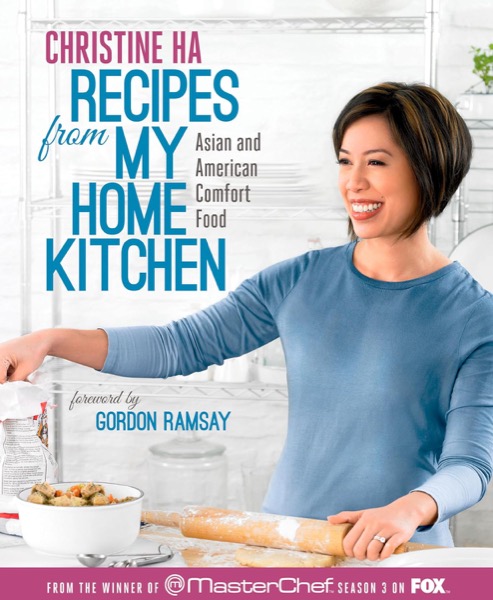 The cover of Recipes from My Home Kitchen: Christine smiling as she rolls out dough in her kitchen.